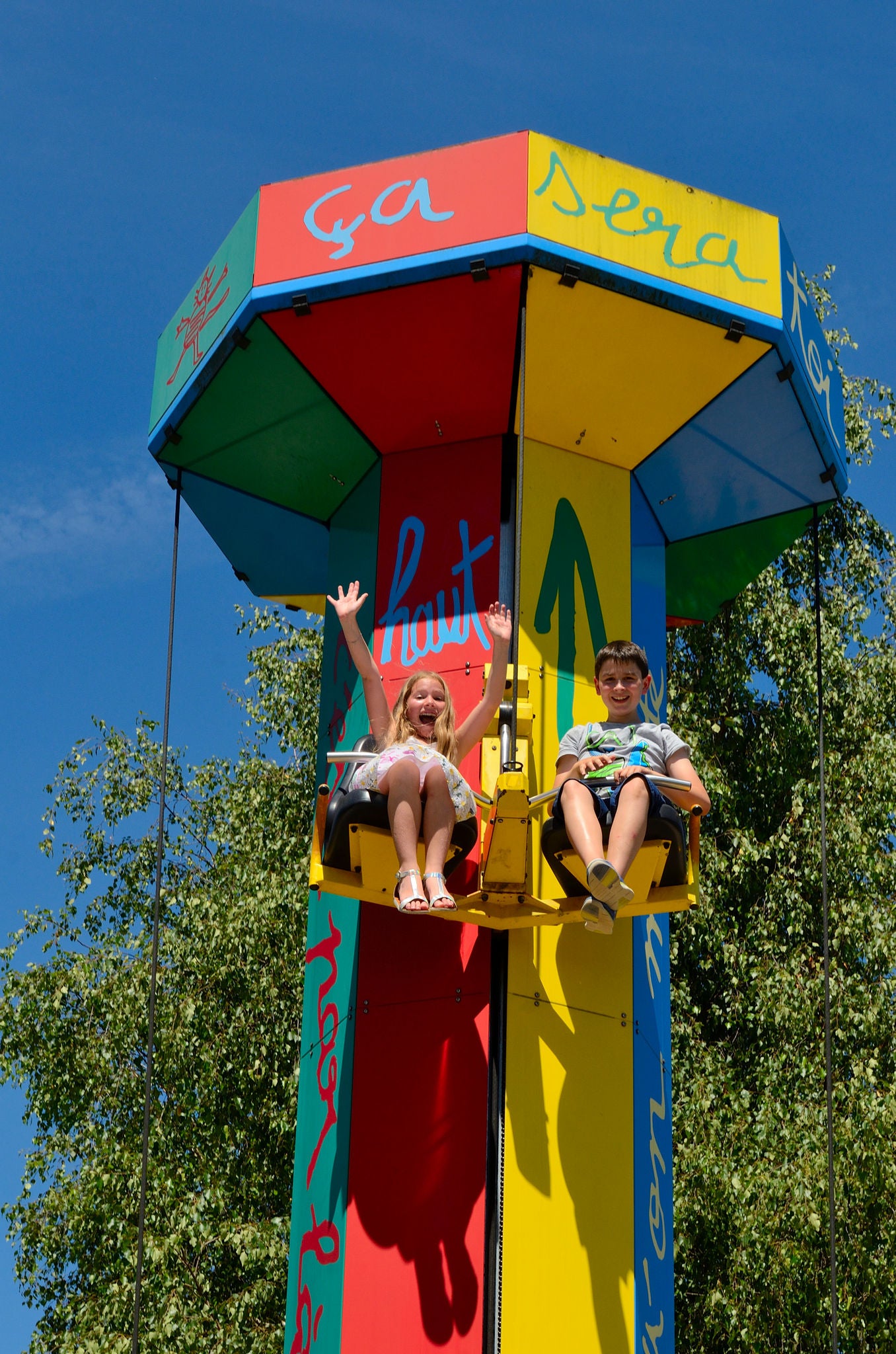 Kids are enjoying the attraction called 'chat perché' at the France Minature park