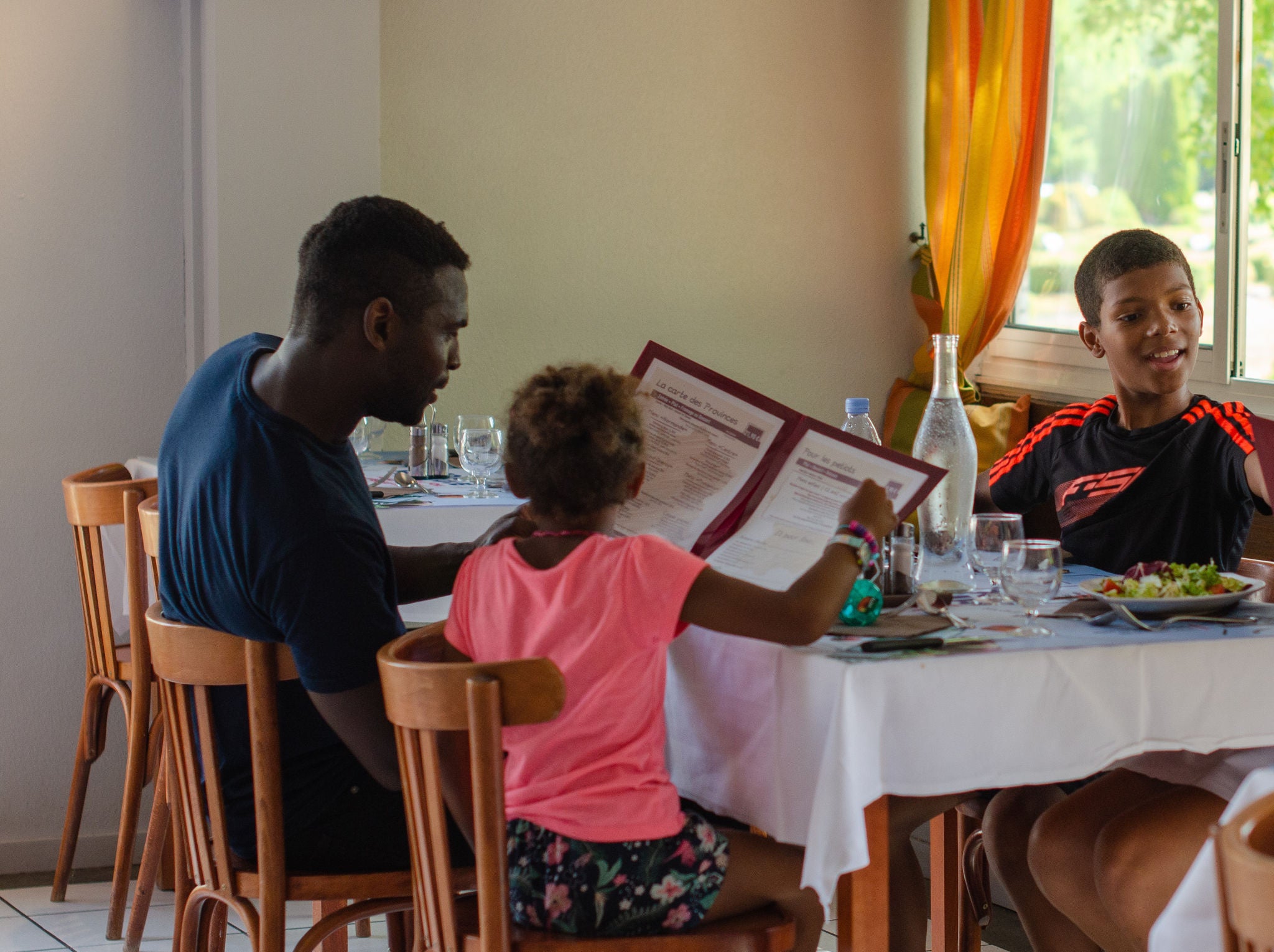 Family Dining Together at the Restaurant "Les Provinces" in France Miniature