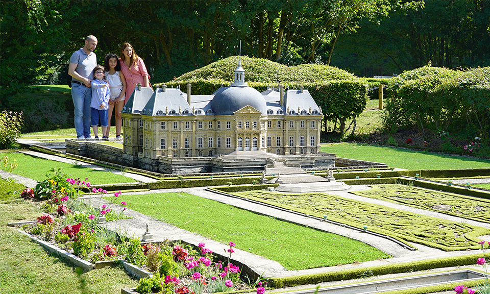 Family near Miniature Chateau vaux le vicomte at France Miniature